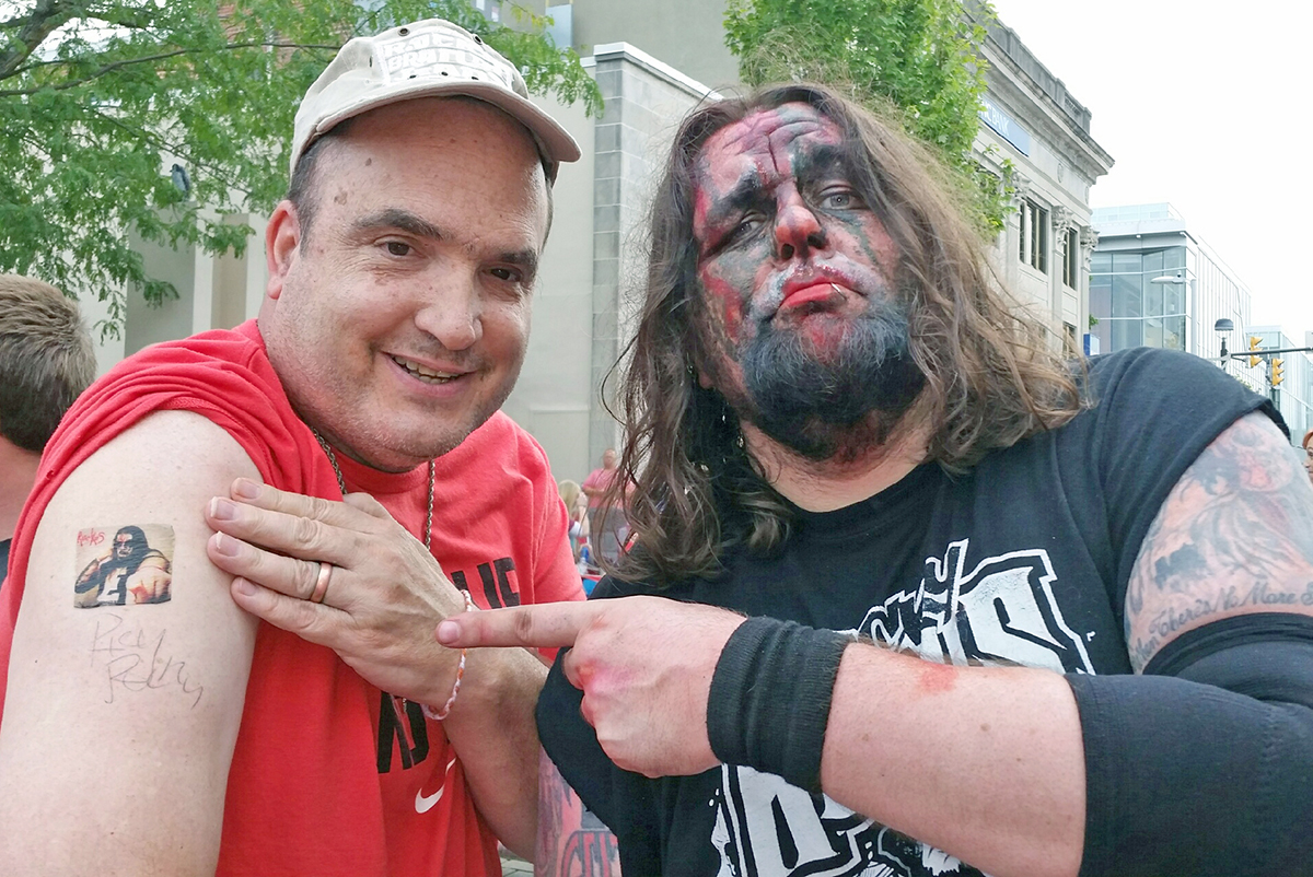 Alan Majors has his picture made with one of his favorite pro wrestlers, Ricky Ruckus, when he appeared in a match in Columbus, Indiana. Because the staff knows and honors Alan's interests and choices, attending this event was a priority.  